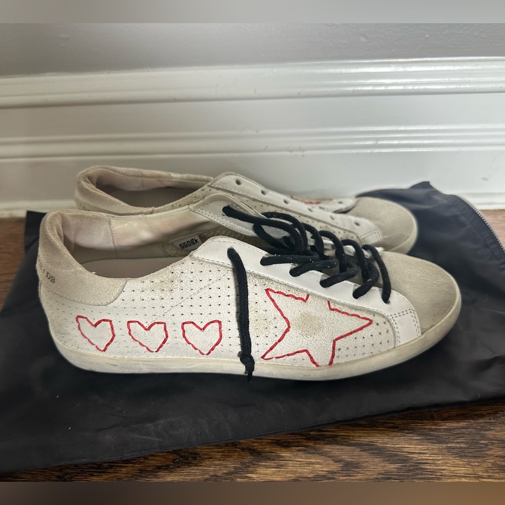 Golden Goose sneakers with red heart stitching. Never worn.